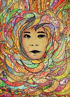 a woman's face is surrounded by many colored circles and lines on the surface