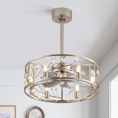 a chandelier hanging from the ceiling in a living room