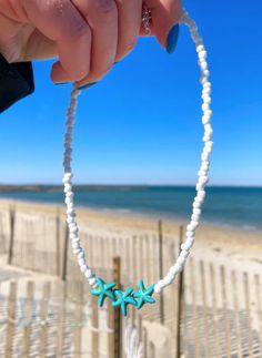 Bohemian White Starfish Jewelry, White Star-shaped Jewelry With Starfish Charm, White Star-shaped Ocean-inspired Jewelry, Starfish Necklace For Beach Season, Ocean-inspired White Star-shaped Jewelry, Ocean-inspired White Star Jewelry, Bohemian White Star Jewelry, White Bohemian Star Jewelry, White Starfish Beaded Necklaces For Beach