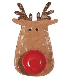 a plastic reindeer with a red bowl in it's mouth