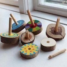 several wooden toys sitting on top of a window sill