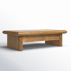 a wooden table sitting on top of a white floor