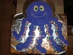 a cake shaped like an octopus with polka dots on it's face and legs