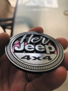 a person holding up a sticker with the words help jeep 4x4 on it