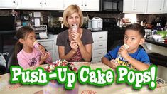 three children sitting at a kitchen table eating cake pops with an adult in the background