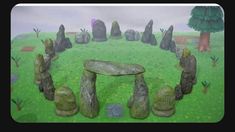 an animated image of a stonehenge in the middle of a grassy area with trees and rocks