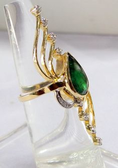 18 k solid gold Natural pear shape Emerald and Diamond set Ring. The beautiful long ring is great for any collection. USA ring size-7.5 ( we can adjust to any size), size of top-5/1.8 cm, weight-8.320 grams, material- 18 K solid gold, natural emerald, Diamonds. with IGI certificate). Elegant Gold Pear-shaped Emerald Ring, Luxury Nature-inspired Emerald Ring, Green Multi-stone Emerald Ring Fine Jewelry, 14k Gold Multi-stone Emerald Ring As A Gift, 14k Gold Multi-stone Emerald Ring Gift, 14k Gold Green Emerald Ring, Fine Jewelry, Art Nouveau Ring, Long Ring, Emerald Diamond Ring