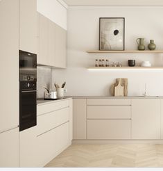 a kitchen with white cabinets and wooden flooring is shown in this image, there are vases on the shelves above the sink