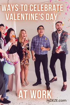 a group of people celebrating valentine's day at work