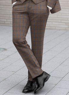 On the hunt for timeless and fashionable pant that guarantees you'll turn heads? Look no further than our Reda Baez Brown Checks Wool Pants. Crafted from pure wool, it gives you natural warmth and unparalleled comfort, showcasing meticulous craftsmanship. This classic pant  is your ticket to making an impression at any event in a professional or social setting.  Look Includes   Reda Baez Brown Checks Wool Fabric  Cross Pocket  Flat Front  Two Welted Back Pockets on Trousers   You can change the Business Winter Trousers, Business Winter Full Length Bottoms, Business Winter Full-length Bottoms, Fitted Brown Ankle-length Dress Pants, Full Length Business Bottoms For Winter, Business Full-length Bottoms For Winter, Tailored Straight Leg Winter Pants, Winter Business Pants Full Length, Straight Pants For Business In Winter