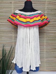 Mexican peasant blouse, with dropped shoulder, fresh blouse, summer blouse, striped blouse. This blouse is ideal for summer, it can be worn on the beach etc. This model comes in two sizes S/M and L/XL Mexican textile art has centuries of history and creativity throughout the country. Mexico is recognized as one of the leading countries with a beautiful aristic production in the textile world, miraculous hands of talented artisans from different states of the country create stunning embroidery cl Mexican Peasant Blouse, Mexican Textiles, Blouse Summer, Summer Blouse, Summer Blouses, Peasant Blouse, Anaheim, Striped Blouse, Textile Art