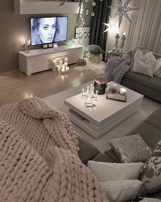 a living room filled with furniture and a flat screen tv