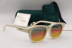 WELCOME TO  DISCOUNTEYEWEAR_RUS !    Authentic GUCCI  SUNGLASSES  made in ITALY BRAND NEW GUCCI GG1238S 003 SHINY IVORY WITH RAINBOW MIRROR LENSES AUTHENTIC SUNGLASSES 53-18 MJ6043 Brand: GUCCI Model #: GG1238S Color Code: 003 Lens Color: MULTICOLOR RAINBOW MIRROR Frame Color: SHINY IVORY COMES WITH GUCCI VELOUR CASE, SILKY POUCH AND SEALED CLOTH  GUCCI CASE COLOR MAY VARY Please use the Measurements &  Fit chart below to see if these glasses will fit. 1: Lens width - 53 mm 2: Bridge -18 mm 3: T Luxury White Sunglasses For Spring, Rainbow Mirror Frame, Designer Gucci Sunglasses For Summer, Spring Designer Sunglasses With Mirrored Lenses, Luxury Cream Sunglasses For Summer, Designer Sunglasses With Uv Protection, Designer Mirrored Sunglasses For Summer, Designer Sunglasses With Uv Protection For Spring, Gucci White Sunglasses With Uv Protection