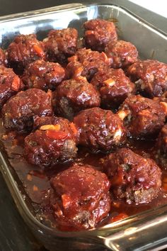 some meatballs are sitting in a pan on the stove top and ready to be cooked