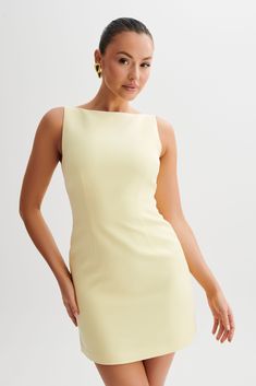 (Not) all business.ANGELA is a sleeveless mini dress with a clean boat neckline and A-line skirt. Crisp and modern, the front features contoured seam lines for a fresh, fitted look. The dress closes with an invisible zip to keep the silhouette smooth, sleek, and sexy. A beautiful blend of stylish and classy, this dress is a versatile wardrobe essential. Accessorise with an oversized blazer, clean earrings, and elegant heels like Geneva Square Diamante Mules. This dress is considered a Micro Mini A Line Dress Aesthetic, 90s Classy Outfits, Mid Length Dresses Classy, Timeless Dresses Classy, Graduation Guest Outfit, Clean Earrings, Meshki Dresses, Dresses Date Night, Black Dress Prom