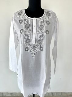 Womens embroidered cotton tunic Chest- 40 inches(Medium Length- 36 inches Sleeves length- 25 **CUSTOMISATION AVAILABLE** We can make the kurta as per your requirement(size, pattern, design etc) Hight quality pure cotton fabric with high quality stitching Can use in parties, office, at beach, casual wear shirt Hand wash or machine wash Cotton Straight Kurta With Embroidered Border, Long Sleeve Cotton Tunic With Intricate Embroidery, Cotton Long Sleeve Tunic With Intricate Embroidery, Cotton Tunic With Intricate Embroidery And Long Sleeves, Spring Cotton Embroidered Kurta, Festive Cotton Tops With Embroidered Border, Cotton Tunic Tops With Intricate Embroidery, White Cotton Tunic With Floral Embroidery, White Folk Style Embroidered Kurta