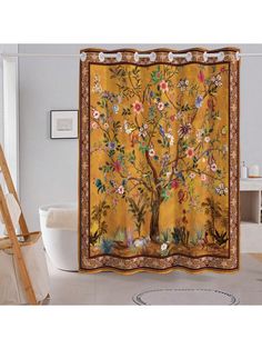 the shower curtain is decorated with an image of a tree and flowers on yellow background