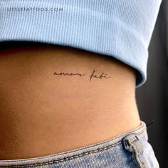 the back of a woman's stomach with an inscription on it that says, every fate