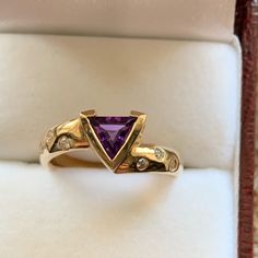 Nwot 14ky Genuine 6mm Trillion Bezel Set Amethyst With .12ctw Of Diamonds That Are Drill Set On Sides Of The Band. The Band Width Measures 4mm, Size 7 Purple Gemstone Diamond Ring In 14k Gold, Purple Diamond Ring In 14k Gold, Fine Jewelry Yellow Gold Amethyst Ring With Brilliant Cut, Yellow Gold Amethyst Ring With Brilliant Cut, Brilliant Cut Yellow Gold Amethyst Ring, Fine Jewelry Yellow Gold Amethyst Diamond Ring, Fine Jewelry Yellow Gold Diamond Amethyst Ring, Luxury Yellow Gold Amethyst Ring For Anniversary, Formal Purple Amethyst Ring With Vvs Clarity