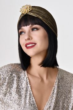 Get ready to channel your inner flapper with this classic turban hat. This simple and elegantly designed wrap will be the finishing touch to your 1920s style looks. Features: Pleated design Decorative rhinestone emblem Head circumference: 22.8'' / 58 cm Shiny rhinestones 1920s Style, Turban Hat, Cloche Hat, Style Looks, 1920s Fashion, Dark Gold, Head Circumference, Getting Ready, Entrance