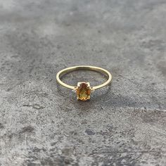 14k yellow gold petite citrine and diamond ring. 0.016cts of diamonds. Finger size 6. Yellow Gold Topaz Ring With Yellow Sapphire Center Stone, Yellow Oval Topaz Ring In 14k Gold, Gold Topaz Birthstone Ring With Diamond, Yellow Gold Citrine Oval Diamond Ring, Yellow Gold Citrine Diamond Ring With Accents, Oval Yellow Topaz Ring In 14k Gold, Oval Citrine Diamond Ring In Yellow Gold, 14k Gold Yellow Diamond Ring, Yellow Gold Diamond Ring With Citrine Accents