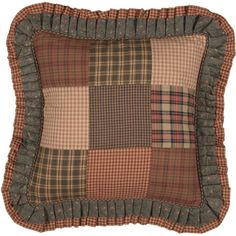 a brown and tan plaid pillow with ruffled edges