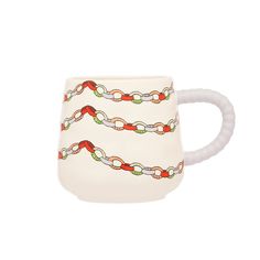 a white mug with a red and green chain on it