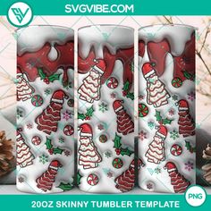 three christmas themed tumbler bottles with candy canes and snowflakes on them