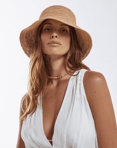 We love a good bucket hat! This versatile hat will go with any vacation look. Features: Fitted 100% Raffia Imported Style# 417-907-053 Short Brim Bucket Hat For Travel And Vacation, Chic Fedora With Short Brim For Vacation, Chic Straw Brimmed Bucket Hat, Chic Brimmed Straw Bucket Hat, Summer Bucket Hat With Curved Brim For Day Out, Chic Straw Bucket Hat With Curved Brim, Beachy Bucket Hat With Curved Brim, Beachy Bucket Hat For Day Out, Chic Natural Bucket Hat