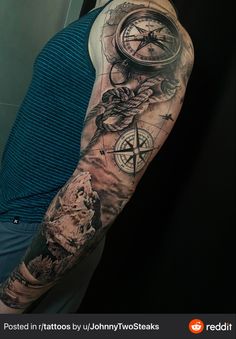 a man with a tattoo on his arm has a wolf and compass in the background