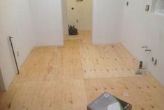 an empty room with hard wood floors and white paint on the walls is being remodeled