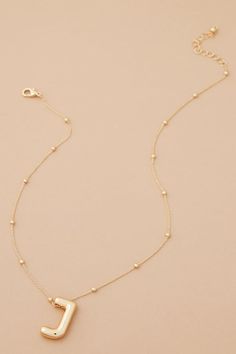 The 18K Gold Monogram Necklace gives any outfit a personal touch! With a dainty chain and initial, this will become your go-to accessory! The perfect layering piece, this necklace makes the perfect gift for friends and family. Gold Monogram Necklace, Necklaces Elegant, Monogram Necklace Gold, Gold Monogram, Dainty Chain, Monogram Necklace, Charm Pendant Necklace, Gold Dipped, Accessories Jewelry Necklace