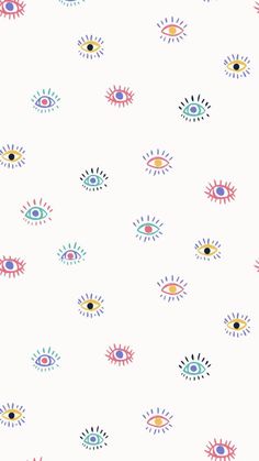 an eye pattern on a white wallpaper with multicolored circles and sunbursts