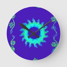 a clock with blue and green designs on it