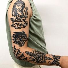 a man with a tattoo on his arm and some other tattoos on his arm,