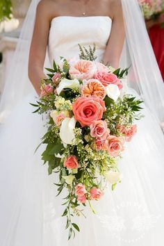 an image of a bride holding her bouquet on her wedding day with the caption