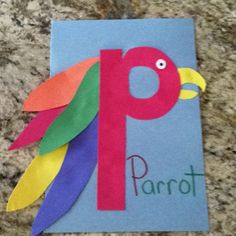 a paper parrot with the letter p on it