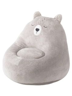 a grey bear shaped chair with eyes closed