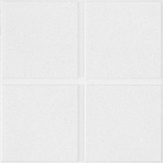 four square white tiles are arranged on the wall