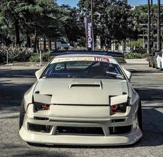 a white sports car parked on the street