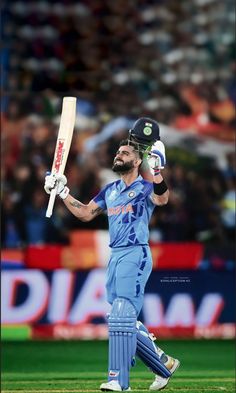 a man with a beard holding a cricket bat in his hand while walking across a field