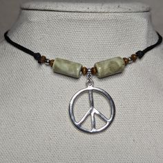 Sage Green Silver Peace Sign Charm Ceramic Wooden Beaded Boho Hippie Adjustable Black Rope Cord Choker Necklace Comes On An Adjustable Waxed Black Cord Necklace. Necklace Is Adjustable From Approximately 13" To 22". Bohemian Jewelry Necklaces, Adjustable Nickel-free Beaded Necklace, Nickel-free Adjustable Casual Necklace, Casual Adjustable Nickel Free Necklace, Silver Casual Beaded Necklace Gift, Silver Casual Beaded Necklace For Gift, Casual Silver Beaded Necklace For Gifting, Casual Silver Beaded Necklace As Gift, Woodstock Theme