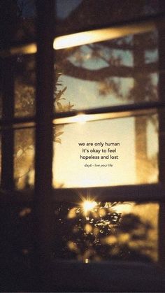 the sun shining through an open window with a quote on it that reads, we are only human