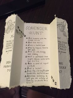 an open book with writing on it and the words'scavenger hunt'written in cursive font