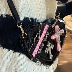 Harajuku Kawaii Fashion Gothic Y2K Cross Heart Bag Size: 18x17/7x6.7" Material: Eco Patent Leather NOTE: DUE TO VERY HIGH DEMAND, PLEASE ALLOW 12-20 DAYS FOR DELIVERY TO THE US, AND 20-45 DAYS TO THE REST OF THE WORLD. Punk Aesthetics, Y2k Cross, Gothic Y2k, Bag Y2k, Cross Heart, Unique Purses, Silver Chains, Heart Bag, Girly Accessories