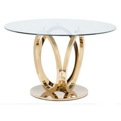 a round glass table with gold metal legs