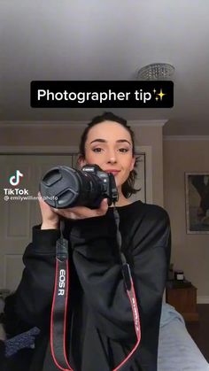 a woman taking a selfie with her camera in front of her face and the words photographer tip above her head