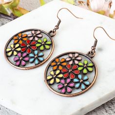 Bohemian Floral Hoop Dangle Earrings Unique Floral Design Enhance your style with these stunning floral design multicolor hoop-drop earrings. Each piece adds an eccentric flair, making them the perfect accessory for any occasion. Versatile Pairing Effortlessly pair these earrings with any ensemble. Whether you're dressing up for a special event or adding a splash of color to your everyday look, these earrings are sure to elevate your outfit. Product Details Item Type: Dangle & Drop Earrings Meta Oil Drip, Hoop Dangle Earrings, Floral Hoops, Bohemian Accessories, Alloy Earrings, Bohemian Floral, Flower Hair Accessories, Flower Oil, Bohemian Earrings