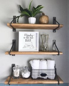 two shelves with towels and other items on them