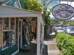 the outside of a shop with many items on display